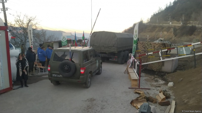   Several more supply cars of Russian peacekeepers pass along Lachin road  