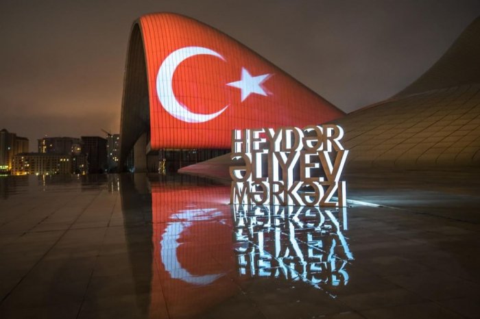   Heydar Aliyev Center in Baku illuminated with colors of Turkish flag  