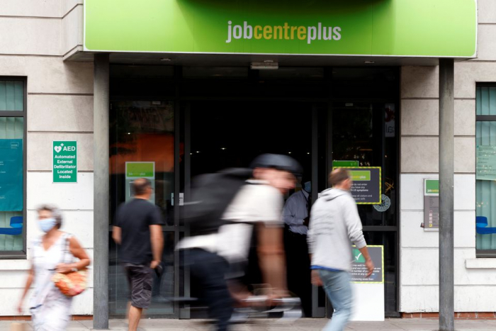 UK basic pay speeds up but jobs market shows some cooling