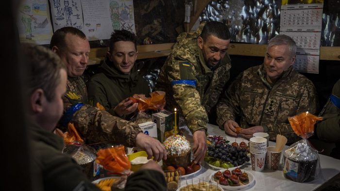   Ukraine army general visits troops for Easter -   NO COMMENT    