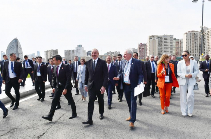 President Ilham Aliyev, First Lady attend opening of exhibition within framework of 74th International Astronautical Congress