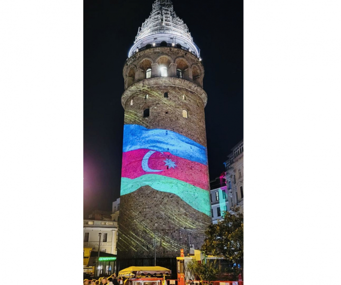   Galata Tower in Istanbul illuminated with colors of Azerbaijani flag  