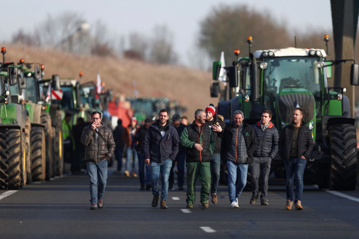 Angry French farmers block highways, step up pressure on the government