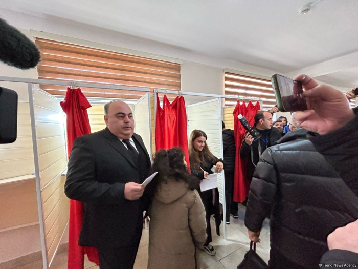 Presidential candidate Fuad Aliyev casts his vote in extraordinary presidential election