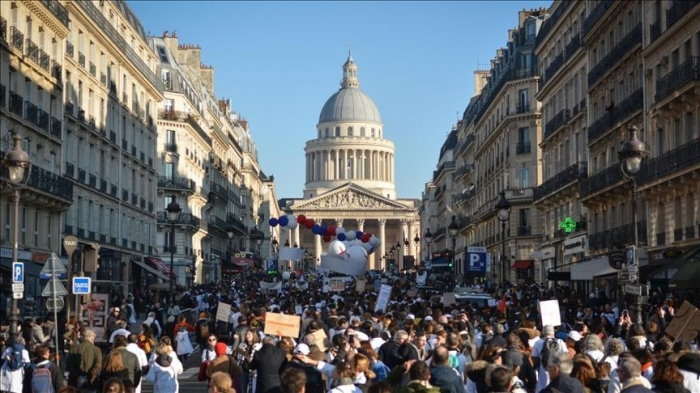 Thousands protest in France demanding repeal of pension reform, higher salaries