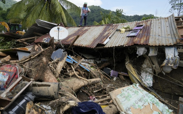 At least 126 dead and missing in massive flooding and landslides in Philippines