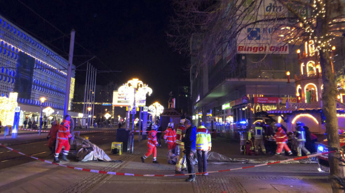   At least 2 dead and dozens injured after car plows into German Christmas market  