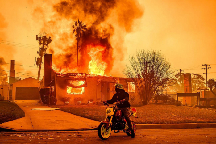 Death toll rises to 16 as firefighters continue to battle spreading wildfires in Los Angeles