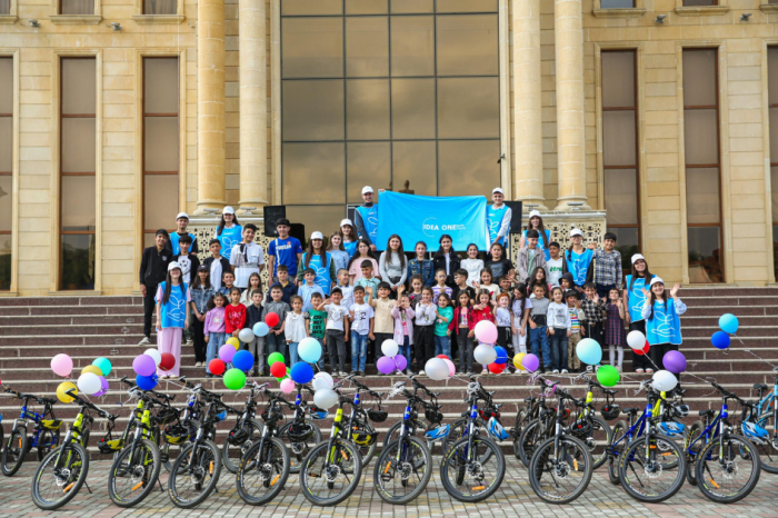 Children and adolescents receive bicycles at Leyla Aliyeva