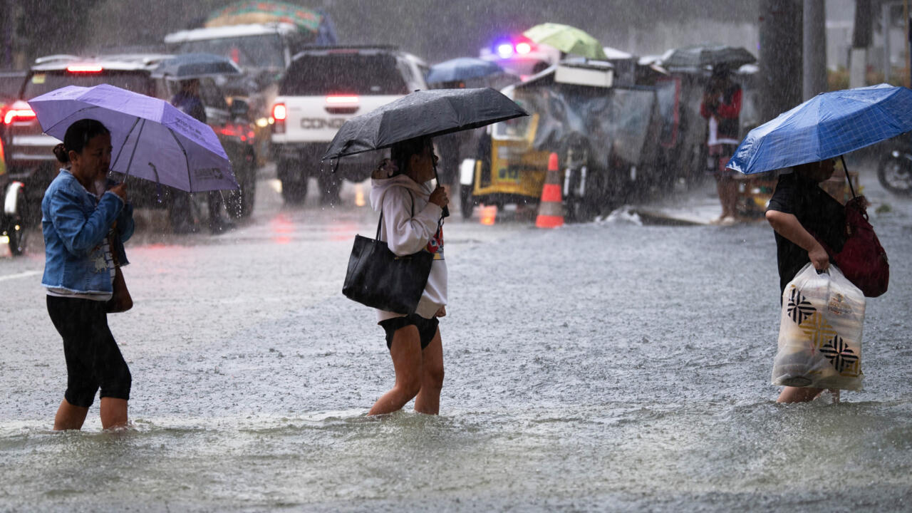 Philippines flooding displaces thousands, two missing