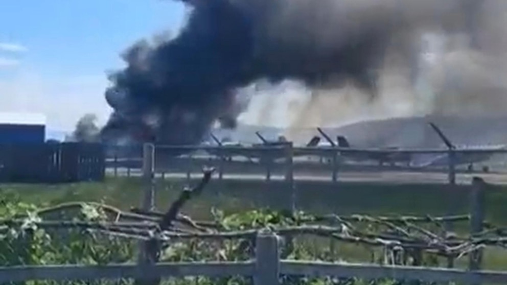Plane crashes into parked aircraft while landing at Montana airport, sparking fire