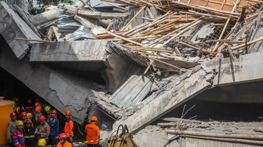 Three dead, dozens trapped after Indonesian school collapses on students