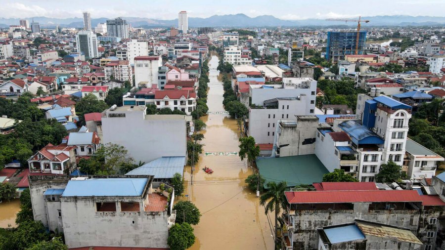 Record flooding hits Vietnam city, eight killed in north