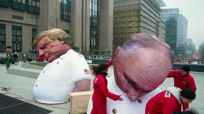   Greenpeace unveils Trump and Putin effigies in Brussels, urges EU to end fossil fuel dependence -   NO COMMENT    