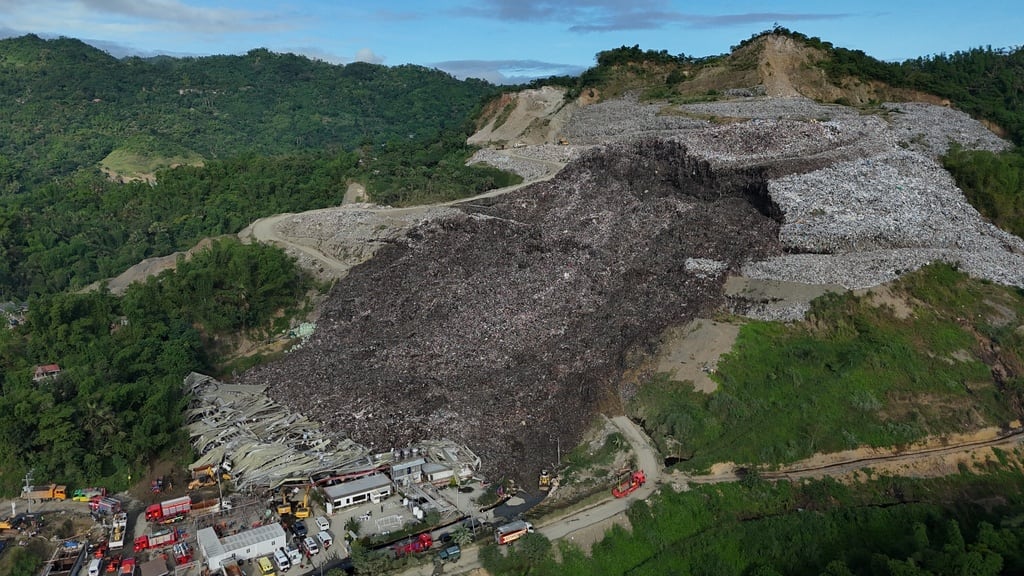 One dead, dozens trapped after giant landfill collapses in Philippines