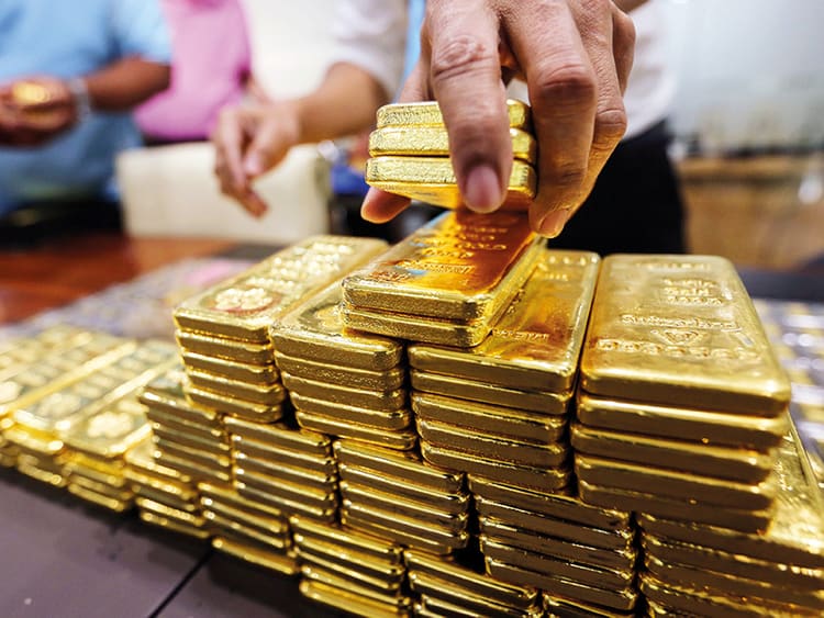 Gold climbs past $5,200 level as US dollar weakens