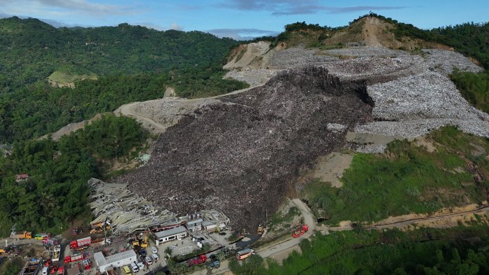 Rescuers race to find dozens missing in deadly Philippines landfill collapse