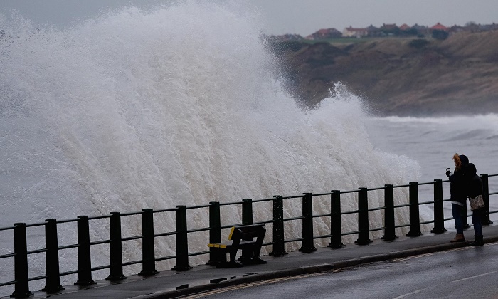 Storms bring snow, high winds and flood warnings to Britain