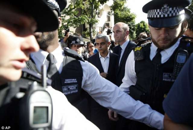 Man led away by police as Sadiq Khan visits Grenfell Tower