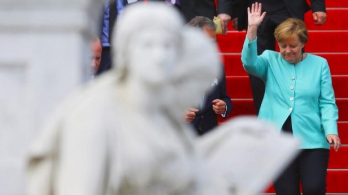 Merkel urges EU to stick together after Brexit talks launched