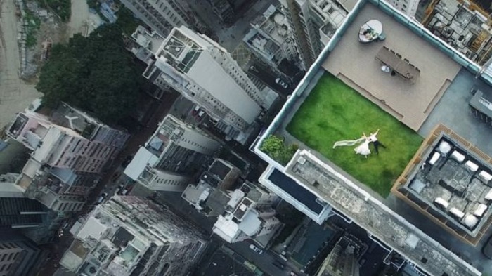 Rooftop `newlyweds` captured by accidental drone shot