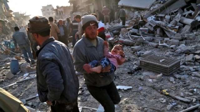 Syria war: Air strikes on Atareb market 'kill more than 50'