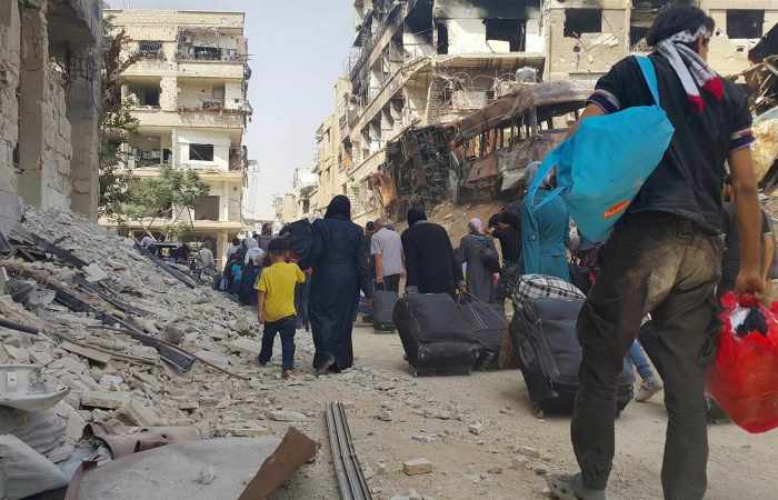 Syrian deal to evacuate tens of thousands of people begins