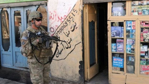 US troops to stay in Afghanistan in policy shift