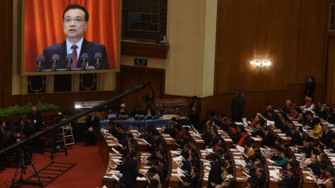 China PM predicts `battle` for growth as target cut