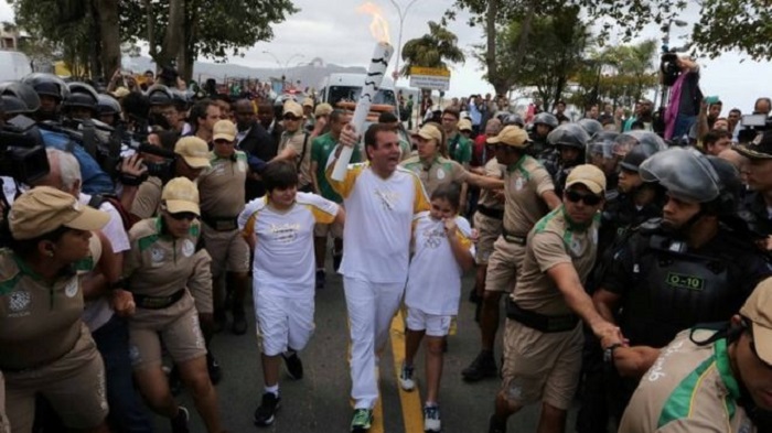 Protest mars Olympic torch Rio arrival ahead of ceremony