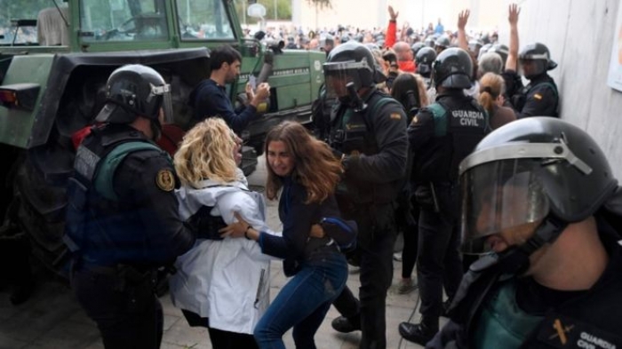 Catalan referendum: Voting begins amid police crackdown