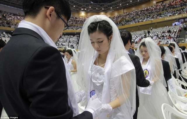 Unification church couples over the moon at mass wedding - NO COMMENT