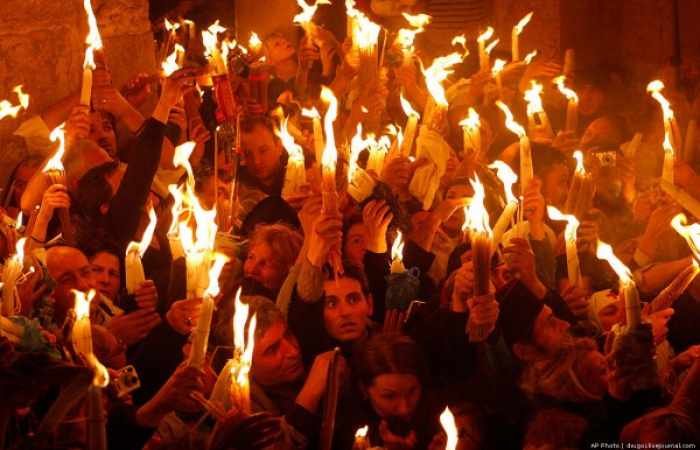 Holy fire descends in Jerusalem as Christians preparing to celebrate Easter
