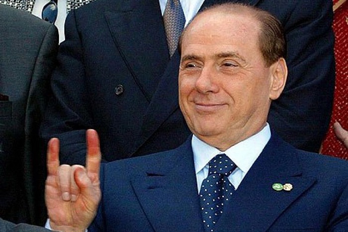 Italy's Berlusconi sent to trial on judicial corruption charge
