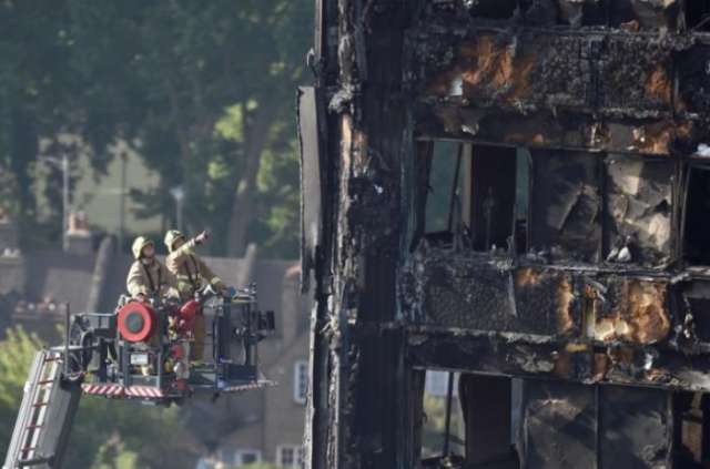 British PM May faces mounting criticism over London tower block blaze