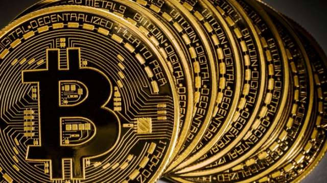 Bitcoin's blistering rally tops $10,000 mark
