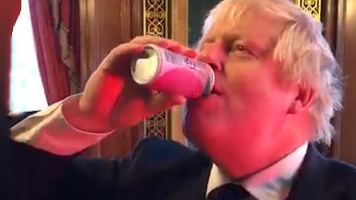 Boris Johnson swigs can of peach juice from Fukushima