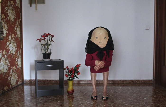 Artist creates bizarre characters by getting models to bend over, drawing faces on them - PHOTOS