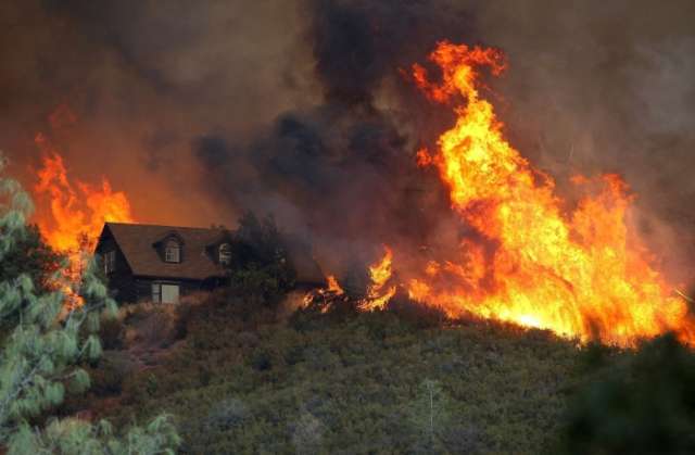 California wildfires burn with little containment as conditions worsen