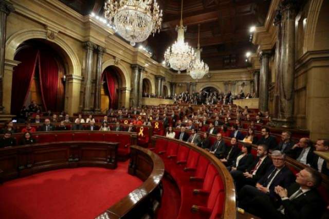 As Catalan parliament meets, some call for fugitive ex-leader to rule by Skype