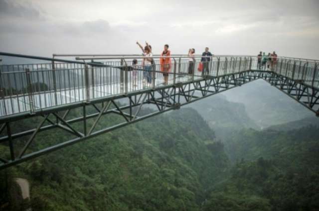 Don't look down: glass bottom skywalk thrills in China