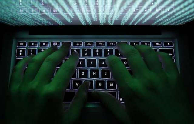 Cyber attack eases, hacking group threatens to sell code