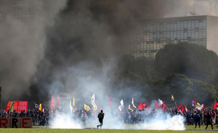 Brazil's Temer deploys army as protesters start fire in ministry