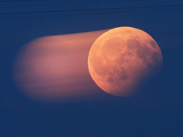 Lunar eclipse pictures show the moon's surface go blood red