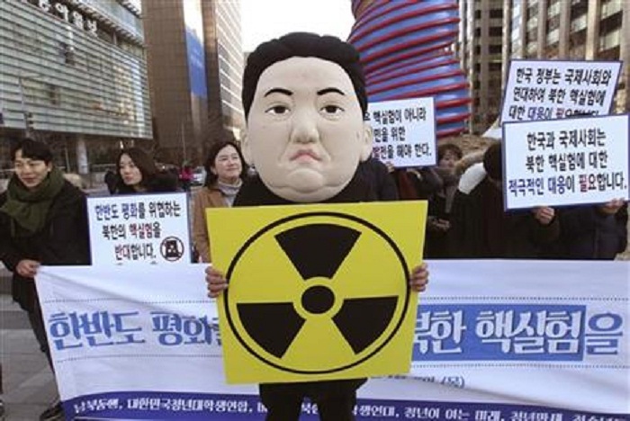 Protesters in Seoul burn effigy of Kim Jong Un