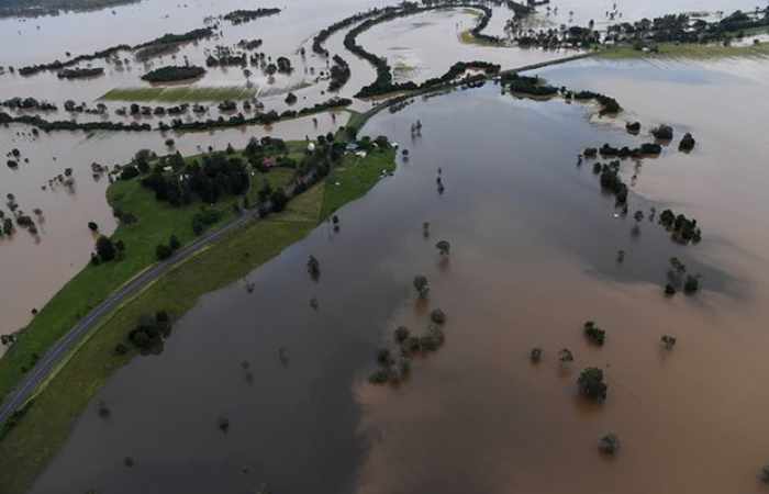Two dead, tens of thousands stranded by Australia floods