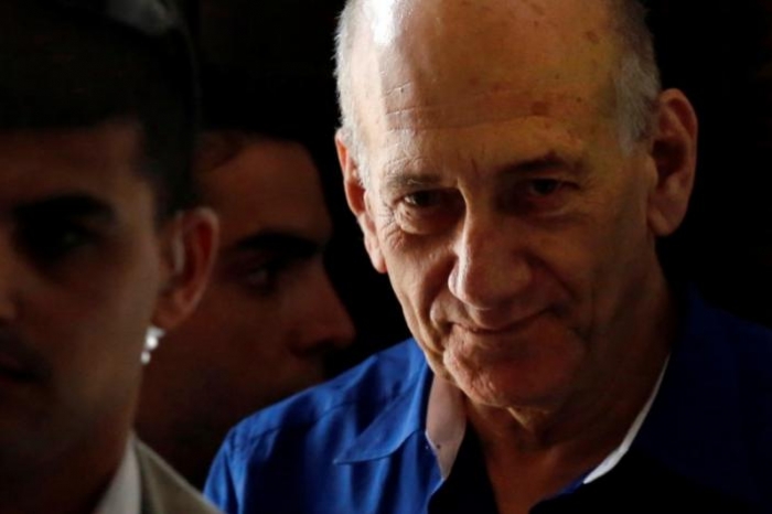 Former Israeli PM Olmert, 71, wins early release from prison