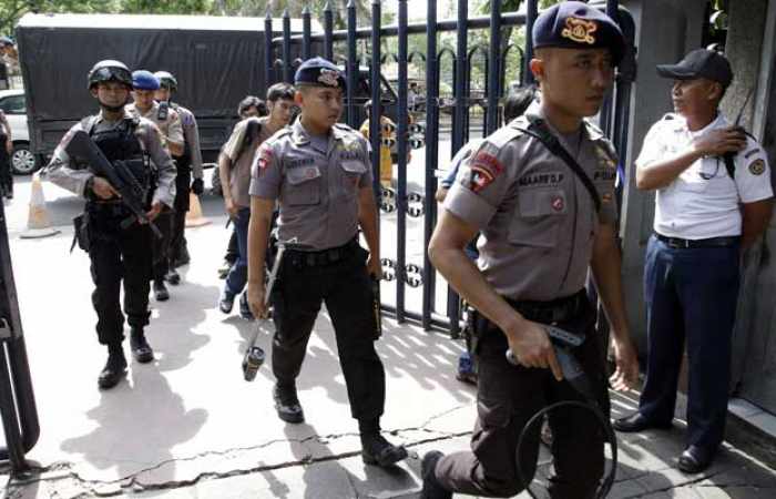 Indonesia police say Interpol issues red notices for three Sinopec executives