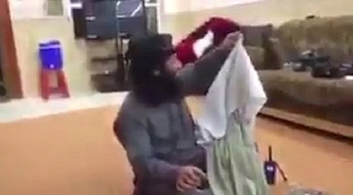 ISIS fighters laugh and joke while woman is raped in the background - VIDEO