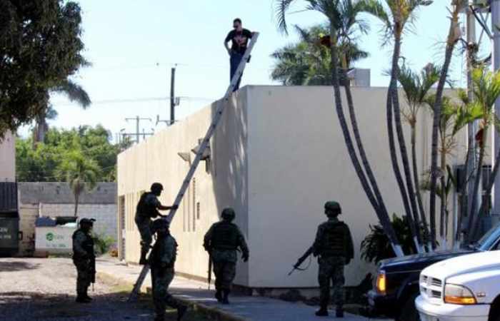 Man's body, seen tossed from plane, found on roof of Mexican hospital